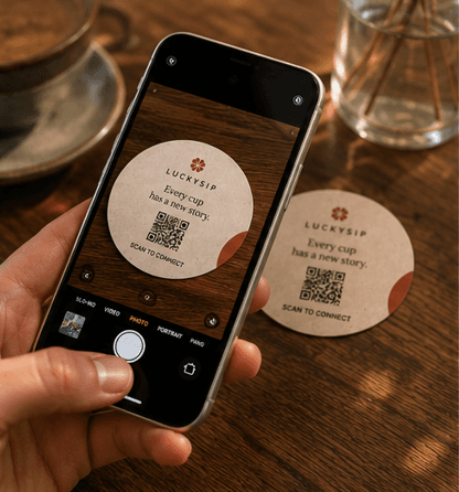 A phone scanning a LuckySip QR card.